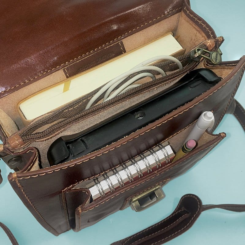 The interior of our Locking "Reporter Bag" of Finest Italian Leather: twin compartments divided by a thin, zippered pocket